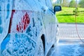 Outdoor car wash with snow foam car wash shampoo Royalty Free Stock Photo