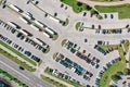 Outdoor carpark with rows of cars. aerial top view in sunny day Royalty Free Stock Photo
