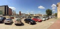 Outdoor cars parking during sunny day under the blue sky.