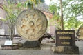 Outdoor Carved sandstone wheel of Dhamma and symbol of Buddhism indicating the current and end of life.