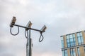 Outdoor CCTV Security camera facing up in British city Royalty Free Stock Photo