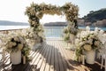 Outdoor ceremony setup with white flowers and greenery Royalty Free Stock Photo