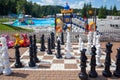 Close up big pieces and giant chess board of street chess in the park Royalty Free Stock Photo