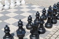 Outdoor chess board with plastic pieces Royalty Free Stock Photo