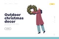 Outdoor Christmas decoration concept of landing page with woman hold xmas wreath