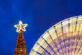 Outdoor Christmas Tree with Spinning Ferris Wheel Royalty Free Stock Photo