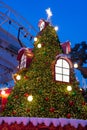 Outdoor christmas treet with colorful lights and decorations