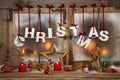 Outdoor christmas window decoration with red candles, deer and t Royalty Free Stock Photo