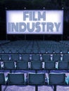Outdoor cinema with plastic chairs in a row and Film Industry on screen - concept image Royalty Free Stock Photo