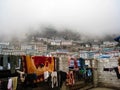 Outdoor clothing at Namche Bazaar in fog