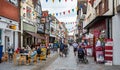 Outdoor coffee drinkers in Butchers Row festooned with bunting in Salisbury, Wiltshire, UK