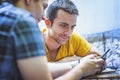 Outdoor coffee shop, two male friends Royalty Free Stock Photo