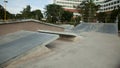 Outdoor concrete skateboard ramp at the park Royalty Free Stock Photo