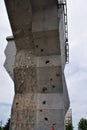 Outdoor construction, wall for training rock climbing, close up detail, gray rainy cloudy sky Royalty Free Stock Photo