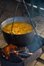 Outdoor cooking, fish soup on fire Royalty Free Stock Photo