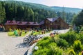 An outdoor courtyard cafe with a hotel with a bicycle parking for children`s playground and a green lawn with growing Royalty Free Stock Photo