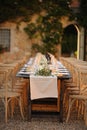 Outdoor courtyard wedding dinner set up Tuscany Italy.