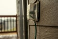 Outdoor covered GCFI outlet with power cord in use Royalty Free Stock Photo