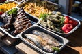 Outdoor Cuisine Culinary Buffet with healthy take away meal - grilled vegetables, fish and meat on the street food culinary market Royalty Free Stock Photo