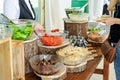 Outdoor Cuisine Culinary salad bar Catering. Group of people in all you can eat. Dining Food Celebration Party Concept. Service at Royalty Free Stock Photo