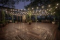 outdoor dance floor surrounded by twinkling fairy lights with magical atmosphere Royalty Free Stock Photo