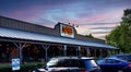 A Night Shot of a Cracker Barrel Restaurant Logo on the Front Entrance of the Building