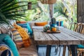 Outdoor dining area with vibrant colorful cushions and chairs. Generative AI Royalty Free Stock Photo