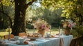 Outdoor dining table setup with rustic bouquets in a garden setting Royalty Free Stock Photo