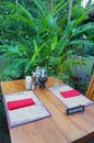 Reserved table, Outdoor dining, tropical resort Royalty Free Stock Photo