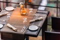 Outdoor dinning table set including plate, cutlery, napkin and wine glass