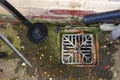 An outdoor domestic drain with an unblocking plunger and stick