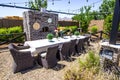 Outdoor Eating Area With Oblong Table & Wicker Chairs