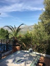 Outdoor eating area with sunny mountain landscape Royalty Free Stock Photo