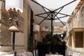 Outdoor eating of a restaurant or cafe in Taormina, Sicily. Decorative lamps and set tables for dining Royalty Free Stock Photo