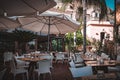 Outdoor eating of a restaurant or cafe in Taormina, Sicily. Table setting for dining Royalty Free Stock Photo