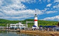 Outdoor eating at tour boat and lighthouse on lake Royalty Free Stock Photo