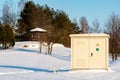 Outdoor electric cabinet on a sunny winter park Royalty Free Stock Photo