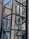 an outdoor elevator with a glass structure can be added to a historic