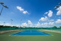 Outdoor empty tennis court with blue sky