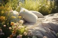 Outdoor escape bed in nature, relaxation with flowers, pillow coverlet