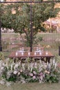 outdoor event, white chairs and tables placed outside witÃÂ° illumination Royalty Free Stock Photo