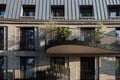 Outdoor exterior front view of brick modern facade and curvature balconies. Royalty Free Stock Photo