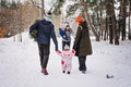 Outdoor family activities for happy christmas winter holidays. Happy father and mother playing with little baby toddler Royalty Free Stock Photo