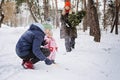 Outdoor family activities for happy christmas winter holidays. Happy father and mother playing with little baby toddler Royalty Free Stock Photo