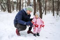 Outdoor family activities for happy winter holidays. Happy father and mother playing with little baby toddler girl Royalty Free Stock Photo