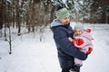 Outdoor family activities for happy winter holidays. Happy father playing with little baby toddler girl daughter in Royalty Free Stock Photo