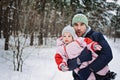 Outdoor family activities for happy winter holidays. Happy father playing with little baby toddler girl daughter in Royalty Free Stock Photo