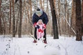 Outdoor family activities for happy winter holidays. Happy father playing with little baby toddler girl daughter in Royalty Free Stock Photo