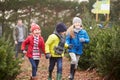 Outdoor Family Choosing Christmas Tree Together Royalty Free Stock Photo