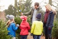 Outdoor Family Choosing Christmas Tree Together Royalty Free Stock Photo